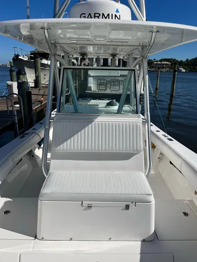 Invictus Yacht Photos Pics Regulator 32 Center Console boat, 2006 model, docked with Garmin equipment.