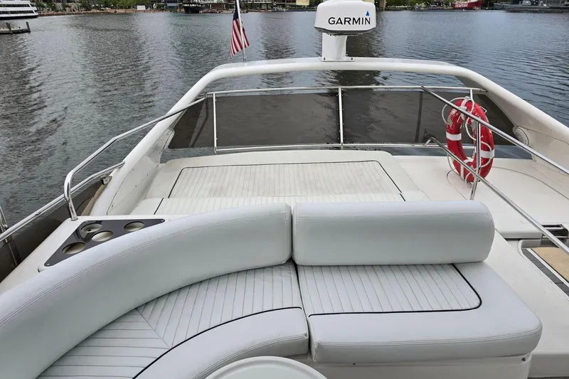  Yacht Photos Pics Luxurious 1999 Viking Princess 56 yacht deck with seating, life ring, and Garmin equipment.