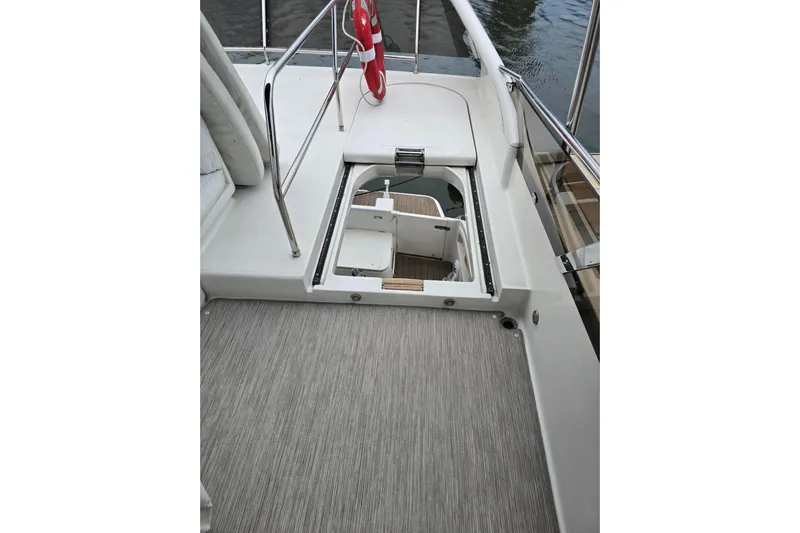  Yacht Photos Pics 1999 Viking Princess 56 yacht deck with open hatch and safety railings.
