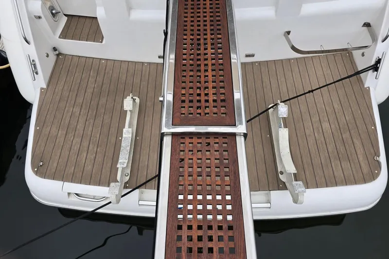  Yacht Photos Pics Stern view of 1999 Viking Princess 56 yacht with wooden deck and gangway.