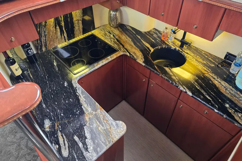  Yacht Photos Pics Luxurious galley kitchen in 1999 Viking Princess 56 yacht with elegant granite countertops.