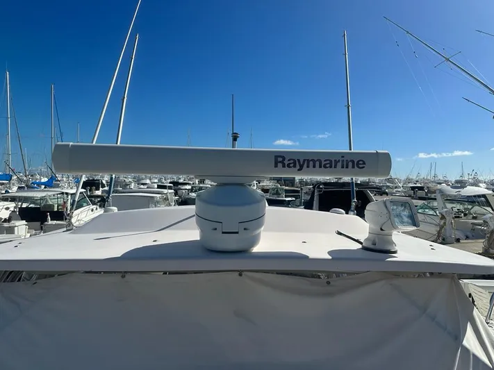  Yacht Photos Pics 2006 Grady-White Express 330 boat with Raymarine radar, docked in a marina.