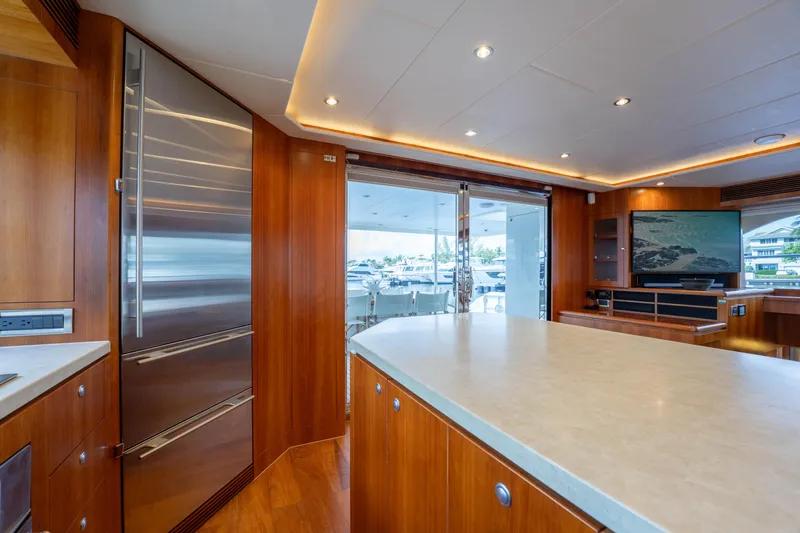 Vitality Yacht Photos Pics Luxurious 2016 Horizon PC60 yacht interior with modern kitchen and entertainment area.