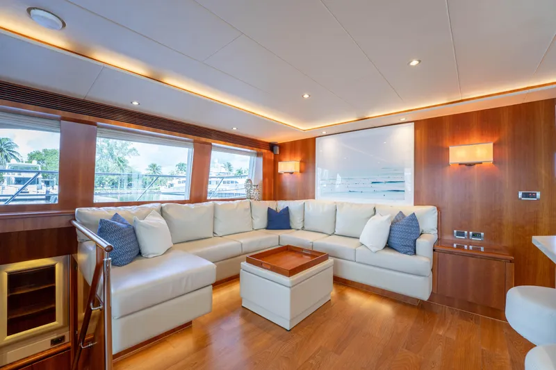 Vitality Yacht Photos Pics Luxurious interior of 2016 Horizon PC60 yacht with elegant seating and modern decor.