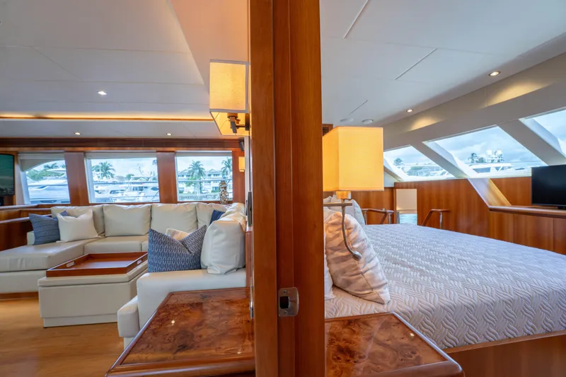 Vitality Yacht Photos Pics Luxurious interior of 2016 Horizon PC60 yacht with elegant seating and bedroom area.