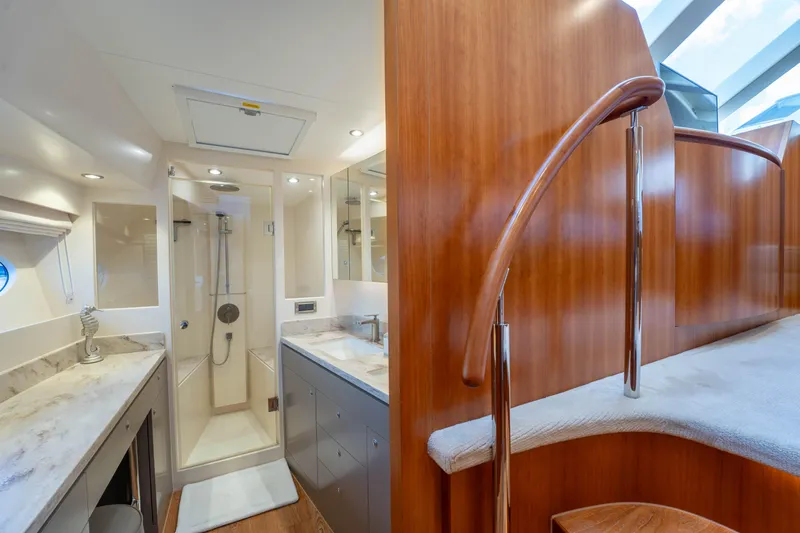 Vitality Yacht Photos Pics Luxurious bathroom in 2016 Horizon PC60 yacht with modern shower and elegant wood finishes.