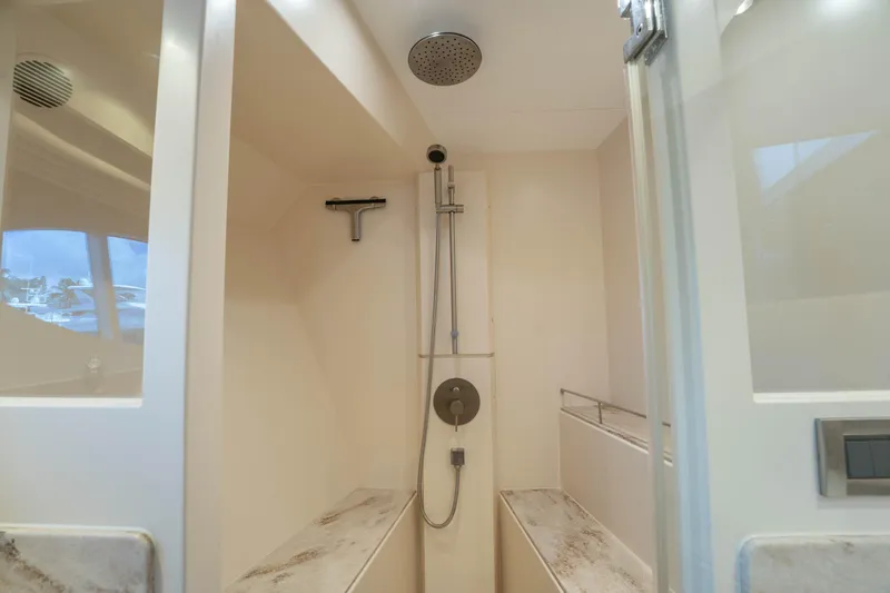 Vitality Yacht Photos Pics Modern shower area in 2016 Horizon PC60 yacht, featuring sleek design and fixtures.