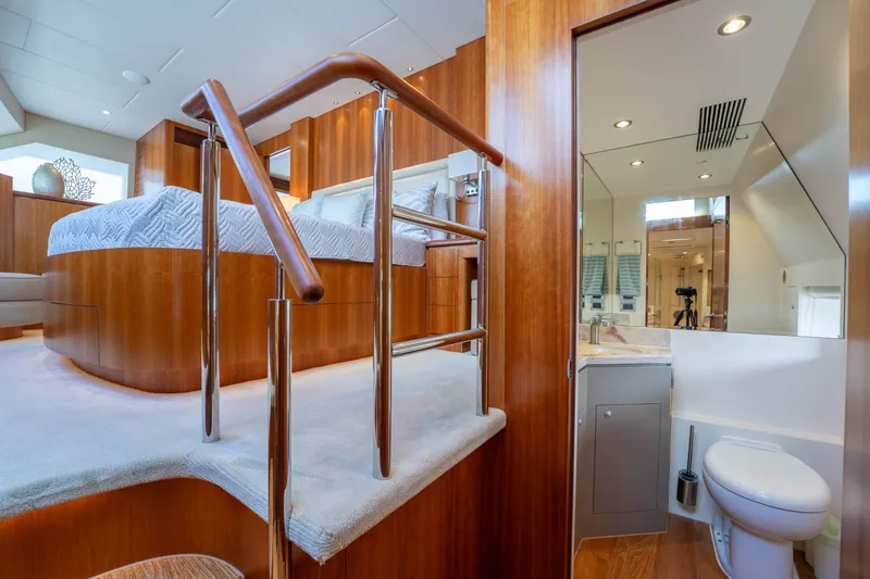 Vitality Yacht Photos Pics Luxurious 2016 Horizon PC60 yacht interior with elegant wood finishes and modern bathroom.