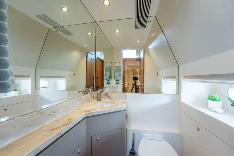 Vitality Yacht Photos Pics Luxurious bathroom interior on a 2016 Horizon PC60 yacht, featuring modern fixtures and elegant design.