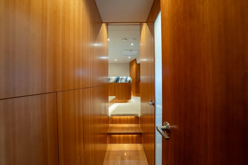 Vitality Yacht Photos Pics Luxurious wooden interior of 2016 Horizon PC60 yacht cabin hallway.