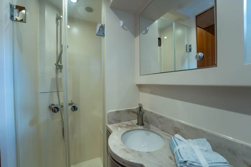 Vitality Yacht Photos Pics Modern bathroom in 2016 Horizon PC60 yacht with shower and marble sink.