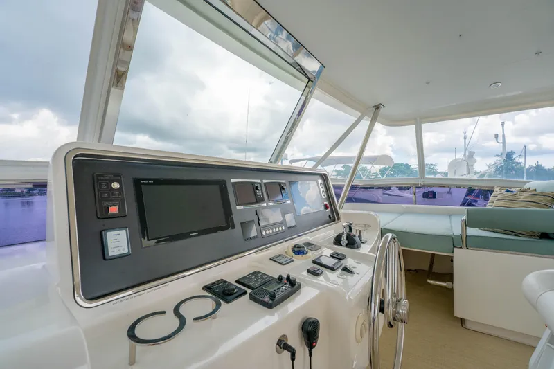 Vitality Yacht Photos Pics Helm of 2016 Horizon PC60 yacht with modern navigation controls and panoramic view.