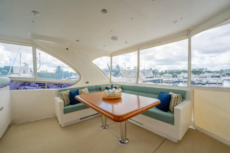 Vitality Yacht Photos Pics Luxurious 2016 Horizon PC60 yacht interior with elegant seating and marina view.