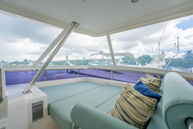 Vitality Yacht Photos Pics Luxurious interior of 2016 Horizon PC60 yacht with comfortable seating and scenic marina view.