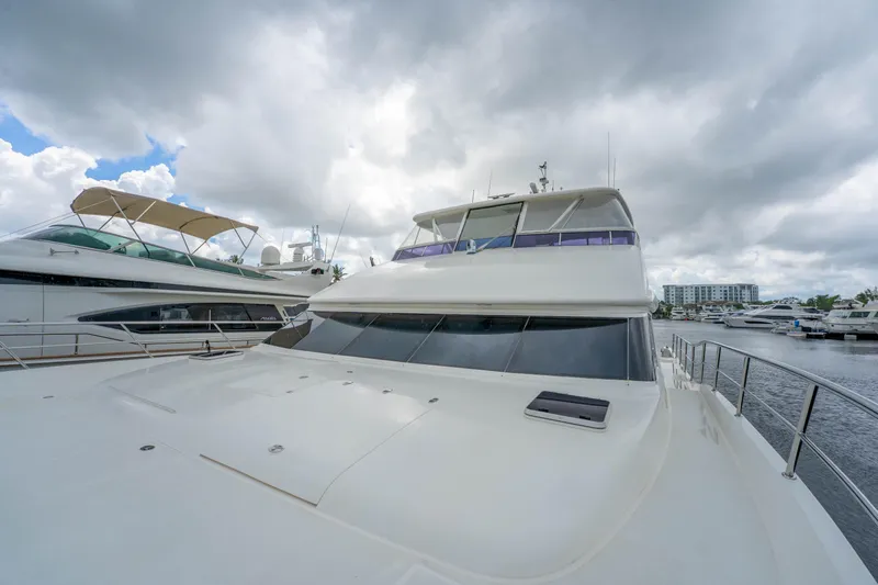 Vitality Yacht Photos Pics Luxury Horizon PC60 yacht docked under cloudy skies, 2016 model.