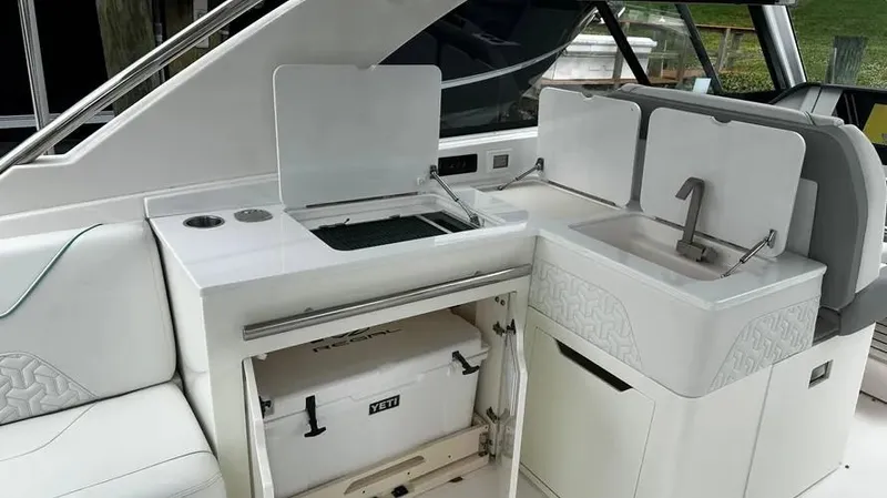  Yacht Photos Pics 2022 Regal LX36 boat interior with kitchenette and sink area.