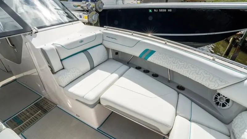  Yacht Photos Pics 2022 Regal LX36 boat interior with white seating and teal accents.