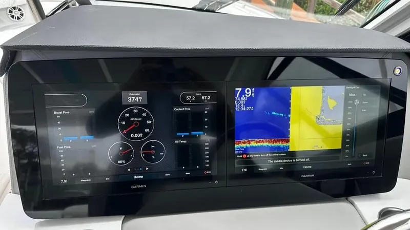  Yacht Photos Pics Dashboard of a 2022 Regal LX36 boat with Garmin navigation displays.