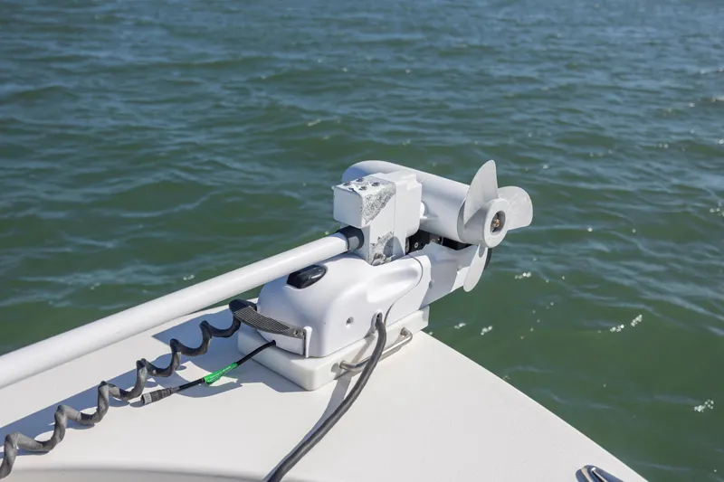  Yacht Photos Pics 2023 Pathfinder 2700 Open boat with trolling motor on water.