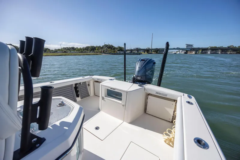  Yacht Photos Pics 2023 Pathfinder 2700 Open boat on water, featuring spacious deck and powerful engine.