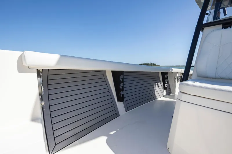  Yacht Photos Pics 2023 Pathfinder 2700 Open boat interior with sleek seating and storage compartments.