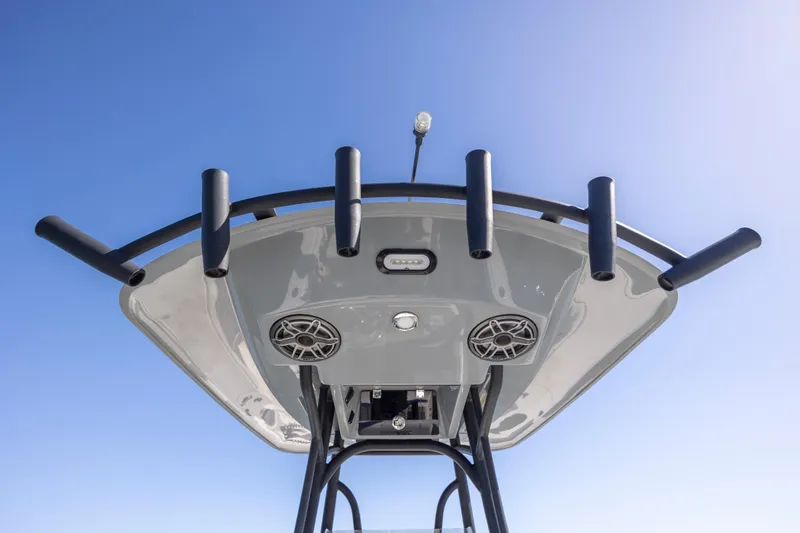  Yacht Photos Pics 2023 Pathfinder 2700 Open boat top view with rod holders and speakers against blue sky.