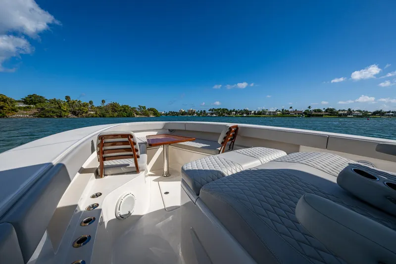 Seas The Day Yacht Photos Pics Luxury seating area on a 2020 Jupiter 43 boat under clear blue skies.
