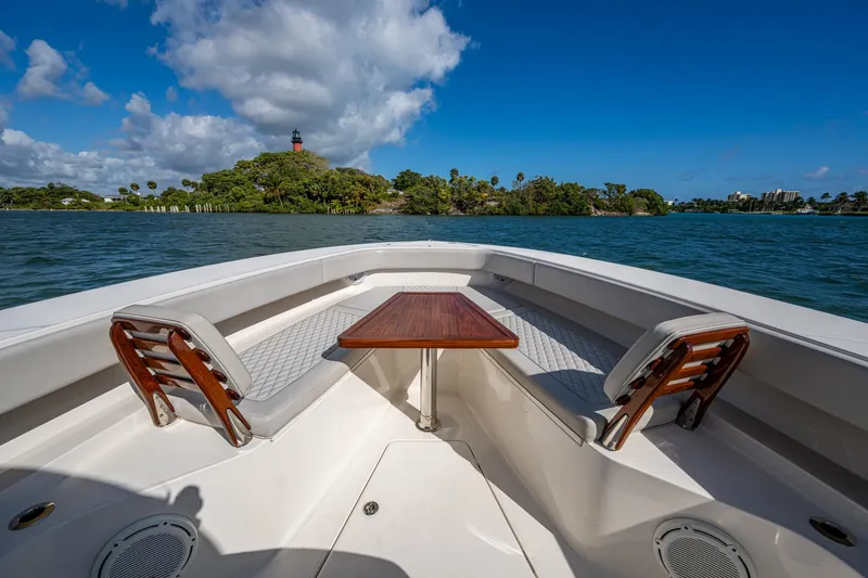 Seas The Day Yacht Photos Pics 2020 Jupiter 43 boat interior with seating and table, scenic water view.