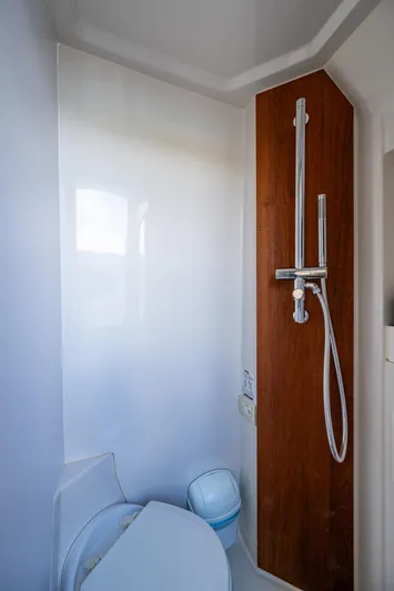 Seas The Day Yacht Photos Pics Compact bathroom with modern shower and toilet in a 2020 Jupiter 43 model.