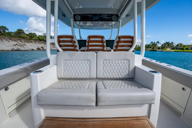 Seas The Day Yacht Photos Pics Luxury seating on a 2020 Jupiter 43 boat, with scenic water view.
