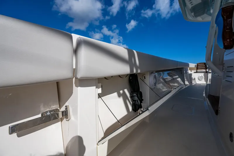 Seas The Day Yacht Photos Pics 2020 Jupiter 43 boat deck with storage compartments under a clear blue sky.