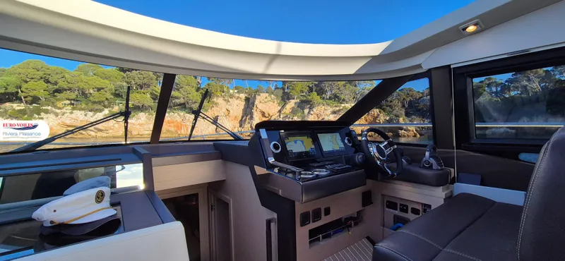 Good Spirit Yacht Photos Pics 2024 Prestige 460S yacht cockpit with modern navigation controls and scenic view.