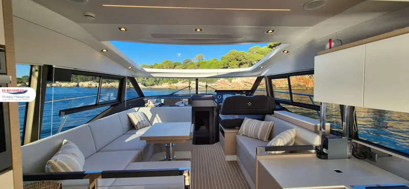 Good Spirit Yacht Photos Pics 2024 Prestige 460S yacht interior with modern seating and panoramic windows.