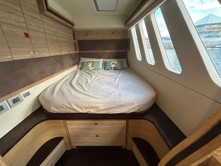  Yacht Photos Pics Luxurious 2019 Xquisite Yachts X5 cabin with cozy bed and scenic windows.