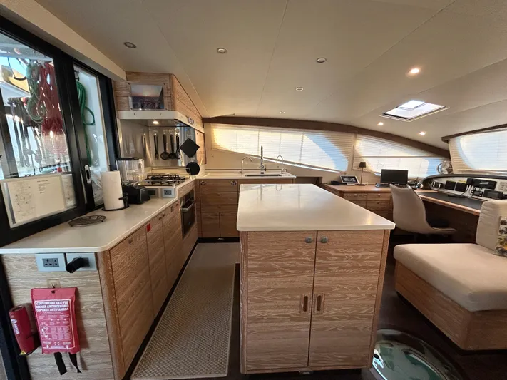  Yacht Photos Pics Luxurious 2019 Xquisite Yachts X5 interior with modern kitchen and seating area.