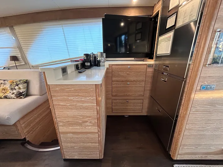  Yacht Photos Pics Luxurious 2019 Xquisite Yachts X5 interior with modern kitchen and entertainment area.