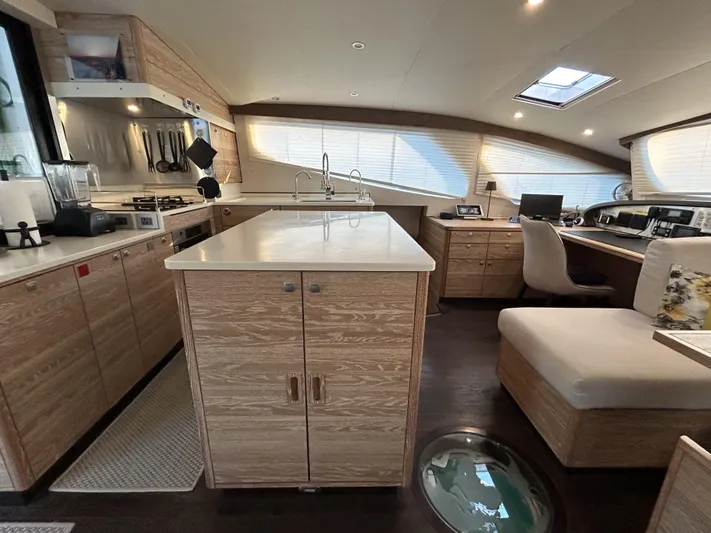  Yacht Photos Pics Luxurious interior of 2019 Xquisite Yachts X5 with modern kitchen and seating area.