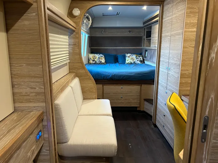  Yacht Photos Pics Luxurious 2019 Xquisite Yachts X5 interior with cozy seating and elegant wood finishes.