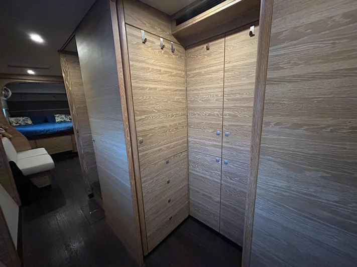  Yacht Photos Pics Luxurious wooden interior of 2019 Xquisite Yachts X5, featuring spacious storage and modern design.