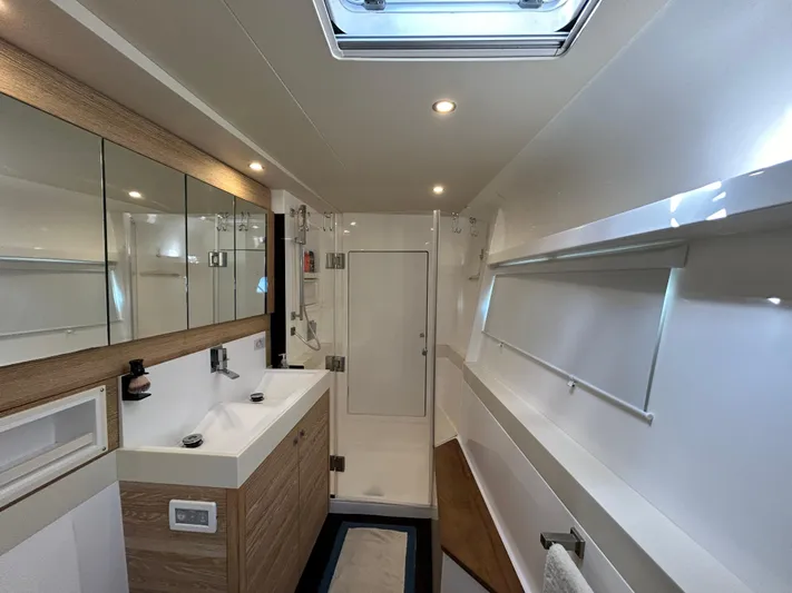  Yacht Photos Pics Luxurious bathroom in 2019 Xquisite Yachts X5, featuring modern fixtures and ample lighting.