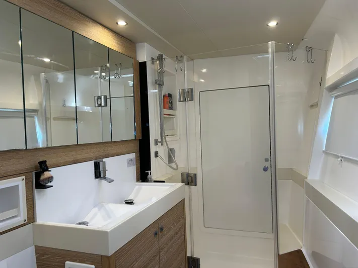  Yacht Photos Pics Luxurious bathroom interior of 2019 Xquisite Yachts X5, featuring modern fixtures and ample storage.