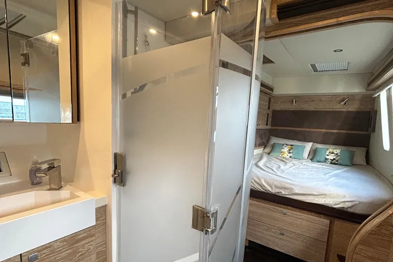  Yacht Photos Pics Luxurious 2019 Xquisite Yachts X5 interior with modern bathroom and cozy bedroom.