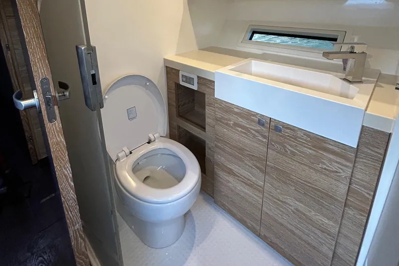  Yacht Photos Pics Modern bathroom in 2019 Xquisite Yachts X5 with wood cabinetry and sleek fixtures.