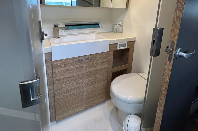  Yacht Photos Pics Luxurious bathroom in 2019 Xquisite Yachts X5, featuring modern sink and toilet.
