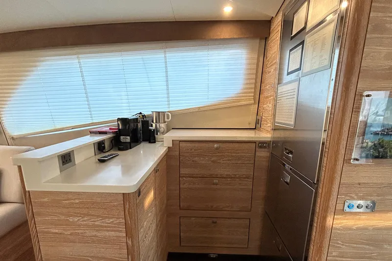  Yacht Photos Pics Luxurious 2019 Xquisite Yachts X5 kitchen interior with modern appliances and wooden cabinetry.