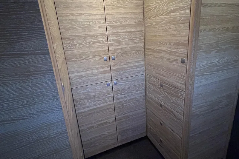  Yacht Photos Pics Wooden cabinetry inside 2019 Xquisite Yachts X5, featuring sleek design and ample storage.