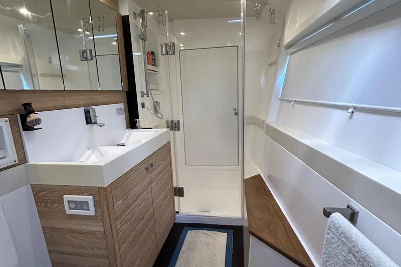  Yacht Photos Pics Luxurious bathroom in 2019 Xquisite Yachts X5, featuring modern fixtures and spacious shower.