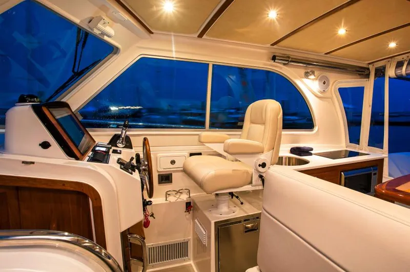 Fifth Child Yacht Photos Pics Manufacturer Provided Image: 2019 Back Cove 34O boat interior with helm station and seating.