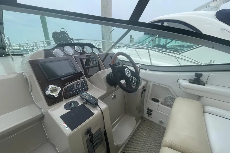 Catalyst Yacht Photos Pics 2009 Sea Ray 330 Sundancer helm with modern controls and comfortable seating.