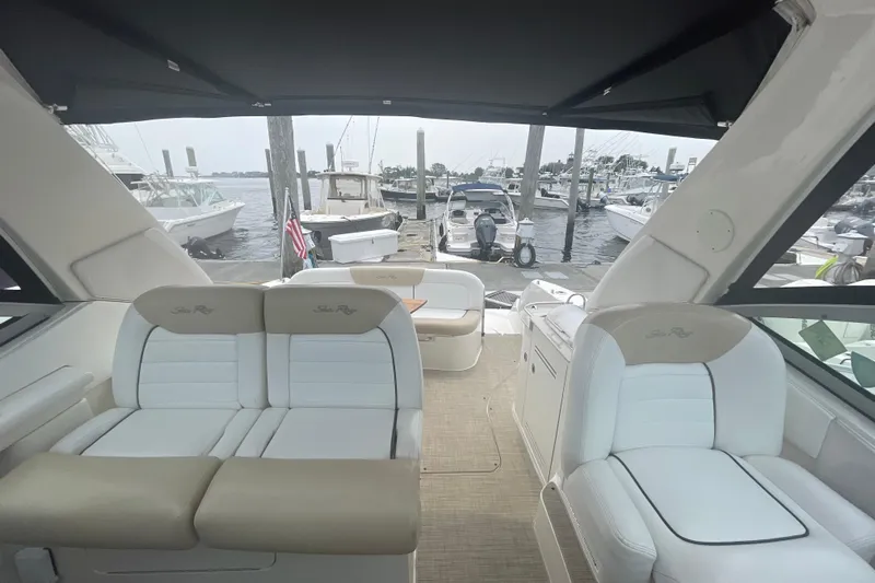 Catalyst Yacht Photos Pics 2009 Sea Ray 330 Sundancer interior with seating, docked at marina.